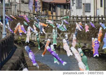 A carp streamer with a spiral pattern sways in the wind. A carp streamer with a spiral pattern sways in the wind. 140073503