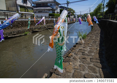 A carp streamer with a spiral pattern sways in the wind. A carp streamer with a spiral pattern sways in the wind. 140073581
