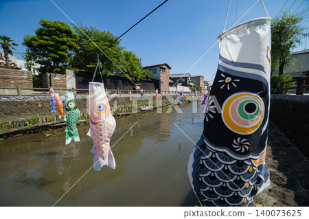 A carp streamer with a spiral pattern sways in the wind. A carp streamer with a spiral pattern sways in the wind. 140073625