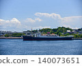A scene of a passenger ship sailing through Yokohama Port in summer, with a clear blue sky and towering cumulonimbus clouds. 140073651