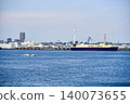 A scene of cargo ships sailing across Yokohama Port under a clear blue summer sky. 140073655