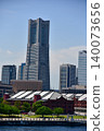 A view of Yokohama Landmark Tower and Red Brick Warehouse soaring against the blue sky. 140073656