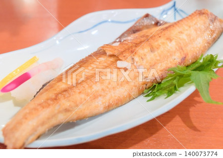 A photo of grilled Atka mackerel, perfect for izakaya (Japanese pub) menus and Japanese set meals. A photo of grilled Atka mackerel, perfect for izakaya (Japanese pub) menus and Japanese set meals. 140073774