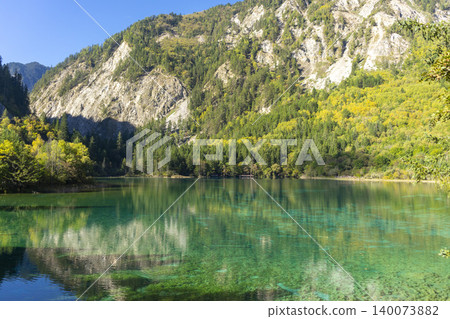 Beautiful view of the Panda Lake at the Rize Valley in Jiuzhaigou nature reserve (Jiuzhai Valley National Park), China Beautiful view of the Panda Lake at the Rize Valley in Jiuzhaigou nature reserve (Jiuzhai Valley National Park), China 140073882