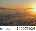 Sea fog illuminated by the rising sun 140073926