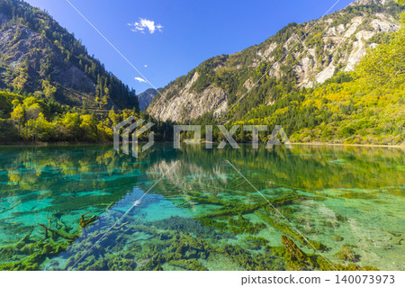 Amazing view of Peacock lake in autumn in Jiuzhaigou nature reserve (Jiuzhai Valley National Park),China. Amazing view of Peacock lake in autumn in Jiuzhaigou nature reserve (Jiuzhai Valley National Park),China. 140073973