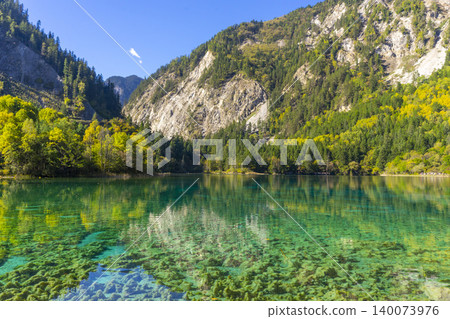 Amazing view of Peacock lake in autumn in Jiuzhaigou nature reserve (Jiuzhai Valley National Park),China. Amazing view of Peacock lake in autumn in Jiuzhaigou nature reserve (Jiuzhai Valley National Park),China. 140073976