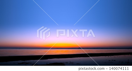 The sunrise over Lake Biwa and the tranquil scenery of its surface. The sunrise over Lake Biwa and the tranquil scenery of its surface. 140074111