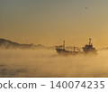 A ship sailing through sea fog 140074235