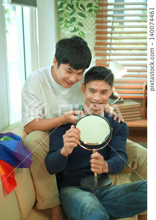 LGBTQ partners sharing beauty routine together LGBTQ partners sharing beauty routine together 140074461