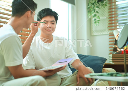 Photo set of LGBTQ applying glitter makeup with partner Photo set of LGBTQ applying glitter makeup with partner 140074562