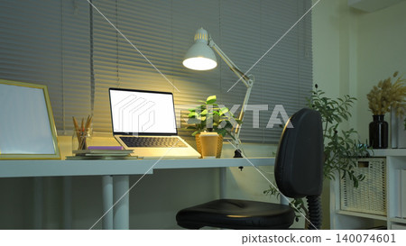 Workspace with laptop mockup desk lamp and home office setup Workspace with laptop mockup desk lamp and home office setup 140074601