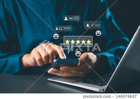 Feedback survey concept features user holding smartphone while giving positive five star rating for customer satisfaction, online service review experience boosts ranking business reputation Feedback survey concept features user holding smartphone while giving positive five star rating for customer satisfaction, online service review experience boosts ranking business reputation 140074687