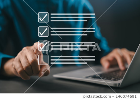 Finger selecting virtual checklist interface, task management planning, business professional executes productivity decision through digital workflow using laptop computer at desk Finger selecting virtual checklist interface, task management planning, business professional executes productivity decision through digital workflow using laptop computer at desk 140074691