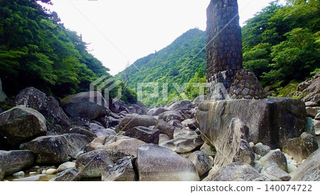 The scenery of clear streams and bridge pier remains left behind by the former Anbo Forest Railway on Yakushima Island. The scenery of clear streams and bridge pier remains left behind by the former Anbo Forest Railway on Yakushima Island. 140074722