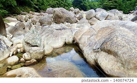 The clear stream left behind by the former Anbo Forest Railway on Yakushima Island The clear stream left behind by the former Anbo Forest Railway on Yakushima Island 140074724