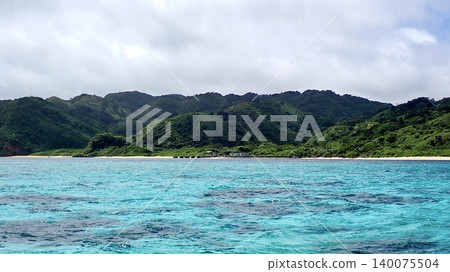 Subtropical mountains and the blue sea stretch across the secluded Oku-Iriomote Island. Subtropical mountains and the blue sea stretch across the secluded Oku-Iriomote Island. 140075504