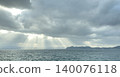 Mysterious crepuscular rays (Jacob's Ladder) pouring down on the surface of the sea and the ocean. 140076118