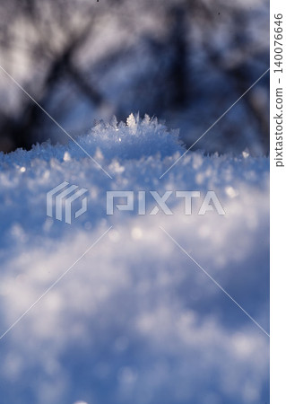 Macro shots of frost crystals in northern Hokkaido, diamond dust on the snow surface, backlit. Macro shots of frost crystals in northern Hokkaido, diamond dust on the snow surface, backlit. 140076646