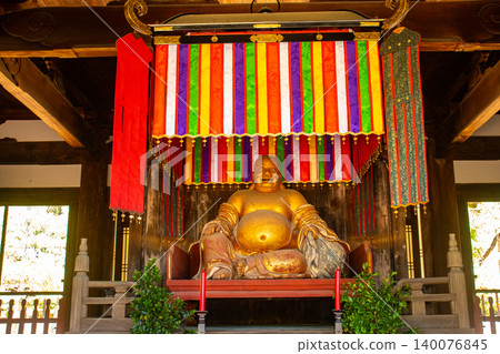 The blessings of the benevolent seated statue of Hotei at Manpuku-ji Temple: business prosperity, good fortune, academic success, and good health and longevity. The blessings of the benevolent seated statue of Hotei at Manpuku-ji Temple: business prosperity, good fortune, academic success, and good health and longevity. 140076845