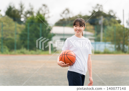 Girls, children, elementary school students, junior high school students, high school students wearing gym clothes and holding basketballs Girls, children, elementary school students, junior high school students, high school students wearing gym clothes and holding basketballs 140077148