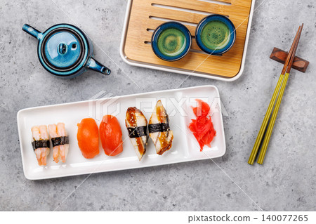 Sushi set with tea and small teapot Sushi set with tea and small teapot 140077265