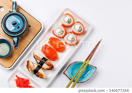 Sushi set with tea and small teapot Sushi set with tea and small teapot 140077268