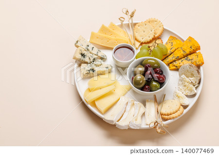 Cheese board with olives grapes and honey Cheese board with olives grapes and honey 140077469