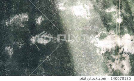 Abstract background of weathered concrete wall with mold texture and hanging roots 140078180