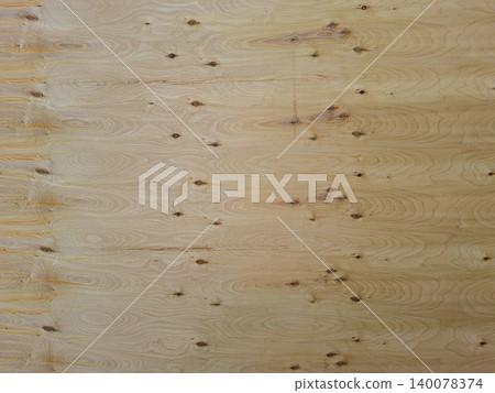Natural wooden plywood sheet shows a grain pattern with knots and lines. This texture can be used for various design and craft activities in workshops or studios. Natural wooden plywood sheet shows a grain pattern with knots and lines. This texture can be used for various design and craft activities in workshops or studios. 140078374