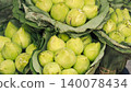 Fresh green lotus flower buds wrapped in lotus leaves for traditional offering 140078434