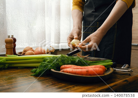Cooking vegetables in a kitchen with fresh produce during the day Cooking vegetables in a kitchen with fresh produce during the day 140078538
