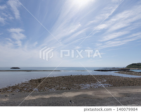 A calm sea under a clear blue sky 140079984