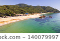 Aerial view of Diamond Long Beach in Fukui Prefecture, showing people enjoying stand-up paddleboarding (SUP) in the crystal-clear waters. 140079997