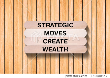 Strategic Moves Create Wealth tagline written on wooden stick with wooden texture background, business and investment, stock market theme, copy space Strategic Moves Create Wealth tagline written on wooden stick with wooden texture background, business and investment, stock market theme, copy space 140080347