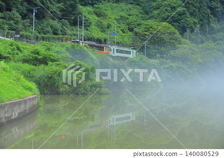 Hayato Station on the Tadami Line running through the fog 140080529