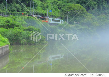 Hayato Station on the Tadami Line running through the fog 140080530