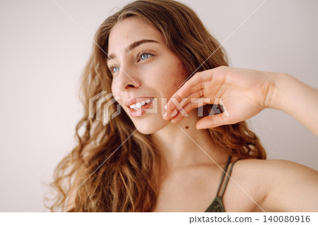 Woman no make up with red spots on her face. Health problem, skin diseases. Medicine and cosmetology 140080916