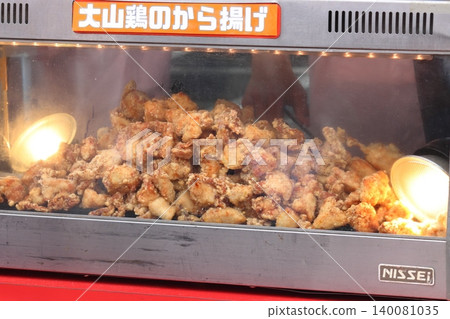 Freshly fried karaage (Japanese fried chicken) - a type of casual, affordable food. Freshly fried karaage (Japanese fried chicken) - a type of casual, affordable food. 140081035