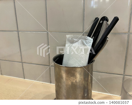 Chopsticks and forks on the counter 140081037