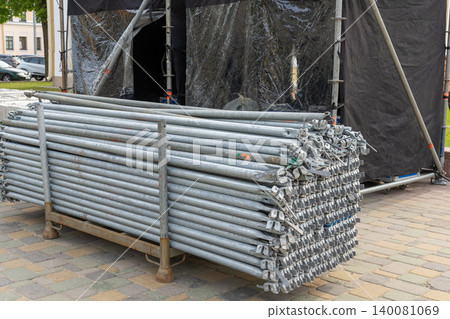 Outdoor stage construction with black tents Outdoor stage construction with black tents 140081069