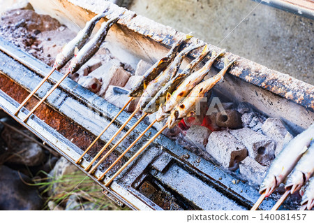 Grilled sweetfish (ayu) on skewers and seasoned with salt. Grilled sweetfish (ayu) on skewers and seasoned with salt. 140081457