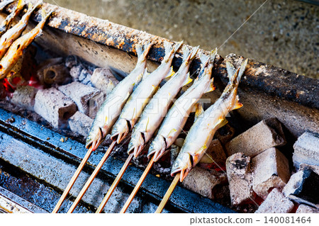 Grilled sweetfish (ayu) on skewers and seasoned with salt. Grilled sweetfish (ayu) on skewers and seasoned with salt. 140081464