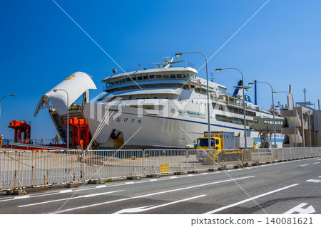 Under a clear blue sky, the large ferry "Okesa Maru" of Sado Kisen docks at Ryotsu Port. Under a clear blue sky, the large ferry "Okesa Maru" of Sado Kisen docks at Ryotsu Port. 140081621