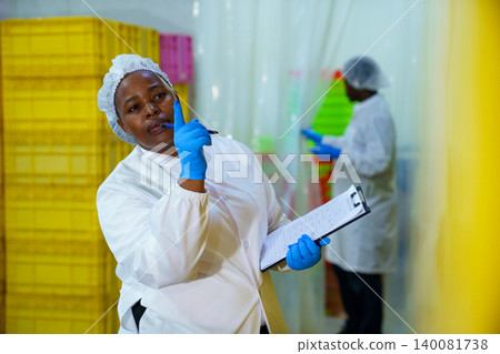 Food Safety Inspector Checking Production in Seafood Processing Factory Food Safety Inspector Checking Production in Seafood Processing Factory 140081738