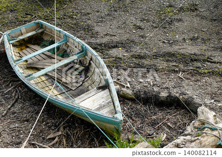 Old boats on the shore line in various state of decay Old boats on the shore line in various state of decay 140082114