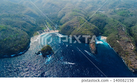 Drone view of dramatic tropical bays surrounded by green hills in Nusa Penida 140082150