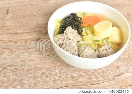 boiled egg tofu with mashed pork and seaweed couple cabbage topping carrot soup on bowl boiled egg tofu with mashed pork and seaweed couple cabbage topping carrot soup on bowl 140082425