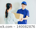 A courier driver delivering a package 140082876