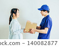 A courier driver delivering a package 140082877